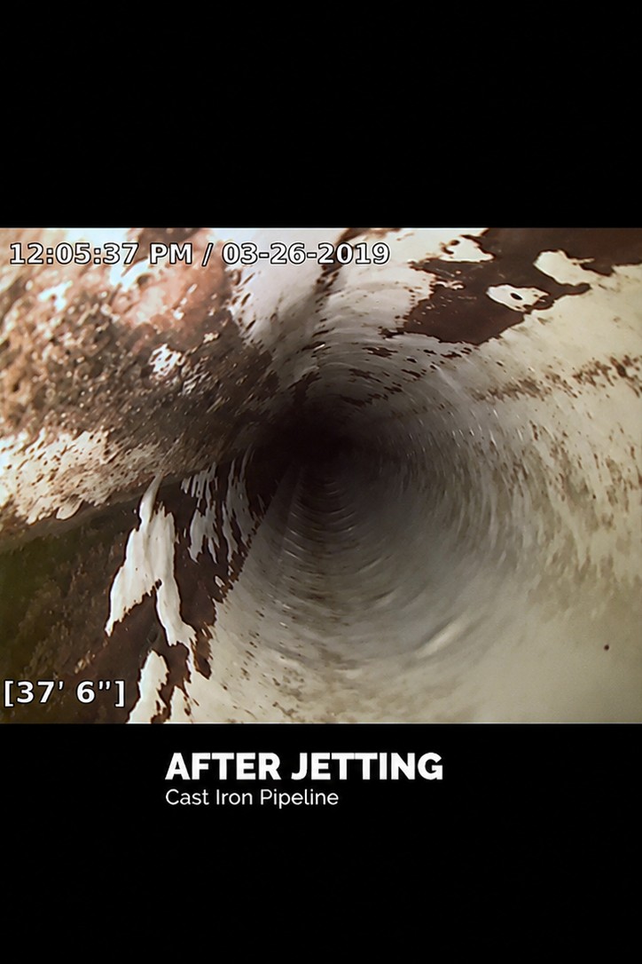 After hydro jetting: sewer camera view of the same Tucson cast iron pipeline cleaned and flowing freely at 37 feet 6 inches.
